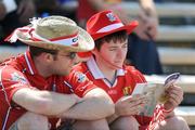 31 May 2009; Cork supporters read their match programme before the game. Munster GAA Hurling Senior Championship Quarter-Final, Tipperary v Cork, Semple Stadium, Thurles, Co. Tipperary. Picture credit: Brendan Moran / SPORTSFILE