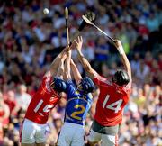 31 May 2009; Cork players Pat Horgan, 15, and Aisake O hAilpin, contest possession with Paddy Stepleton, Tipperary. Munster GAA Hurling Senior Championship Quarter-Final, Tipperary v Cork, Semple Stadium, Thurles, Co. Tipperary. Picture credit: Daire Brennan / SPORTSFILE