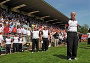 31 May 2009; Tyrone manager, Mickey Harte, stands for the national anthem. Ulster GAA Football Senior Championship Quarter-Final, Tyrone v Armagh, St. Tiernach's Park, Clones, Co.Monaghan. Picture credit: Oliver McVeigh / SPORTSFILE
