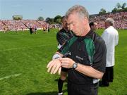 31 May 2009; Referee Pat McEnaney checks one of his watches before the game. Ulster GAA Football Senior Championship Quarter-Final, Tyrone v Armagh, St. Tiernach's Park, Clones, Co.Monaghan. Picture credit: Oliver McVeigh / SPORTSFILE
