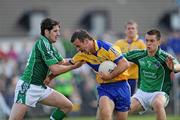 7 June 2009; Laurence Healy, Clare, in action against Padraig Browne and Patrick Ranahan,7, Limerick. Munster GAA Football Senior Championship Semi-Final, Clare v Limerick, Cusack Park, Ennis, Co. Clare. Picture credit: Matt Browne / SPORTSFILE