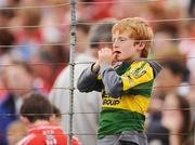 7 June 2009; A young Kerry supporter watches on during the game. Munster GAA Football Senior Championship Semi-Final, Kerry v Cork, Fitzgerald Stadium, Killarney, Co. Kerry. Picture credit: Stephen McCarthy / SPORTSFILE
