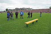 7 June 2009; Photographers leave the pitch as the team bench sits empty after neither team sat for the traditional team photograph before the game. Munster GAA Football Senior Championship Semi-Final, Kerry v Cork, Fitzgerald Stadium, Killarney, Co. Kerry. Picture credit: Brendan Moran / SPORTSFILE