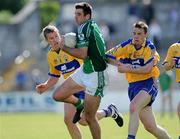 7 June 2009; John Galvin, Limerick, in action against Ger Quinlan, left, and Kevin Dilleen, right, Clare. Munster GAA Football Senior Championship Semi-Final, Clare v Limerick, Cusack Park, Ennis, Co. Clare. Picture credit: Matt Browne / SPORTSFILE