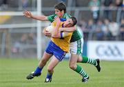 7 June 2009; Graham Kelly, Clare, is tackled by Padraig Browne, Limerick. Munster GAA Football Senior Championship Semi-Final, Clare v Limerick, Cusack Park, Ennis, Co. Clare. Picture credit: Matt Browne / SPORTSFILE