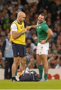 18 October 2015; Ireland's Dave Kearney reacts as he receives treatment for a finger injury from Ireland team doctor Dr. Eanna Falvey. 2015 Rugby World Cup Quarter-Final, Ireland v Argentina. Millennium Stadium, Cardiff, Wales.