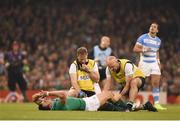 18 October 2015; Tommy Bowe, Ireland, is attended to by Ireland team doctor Dr Eanna Falvey, left, and Ireland physiotherapist James Allen before leaving the field with an injury. 2015 Rugby World Cup Quarter-Final, Ireland v Argentina. Millennium Stadium, Cardiff, Wales.  Picture credit: Stephen McCarthy / SPORTSFILE