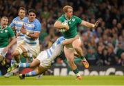 18 October 2015; Luke Fitzgerald, Ireland, is tackled by Santiago Cordero, Argentina, during the build-up to Ireland's second try, eventually scored by Jordi Murphy. 2015 Rugby World Cup Quarter-Final, Ireland v Argentina. Millennium Stadium, Cardiff, Wales. Picture credit: Brendan Moran / SPORTSFILE