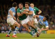 18 October 2015; Dave Kearney, Ireland, is tackled by Nicolas Sanchez, left, Juan Martin Hernandez, and Matias Moroni, right, Argentina. 2015 Rugby World Cup Quarter-Final, Ireland v Argentina. Millennium Stadium, Cardiff, Wales. Picture credit: Brendan Moran / SPORTSFILE