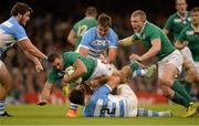 18 October 2015; Dave Kearney, Ireland, is tackled by Juan Martin Hernandez, and Facundo Isa, Argentina. 2015 Rugby World Cup Quarter-Final, Ireland v Argentina. Millennium Stadium, Cardiff, Wales. Picture credit: Brendan Moran / SPORTSFILE