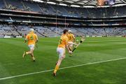 7 June 2009; The Antrim captain Neil McGarry leads team-mates Conor John McGourty and Johnny Campbell, left, out before the game. Leinster GAA Hurling Senior Championship First Round, Dublin v Antrim, Croke Park, Dublin. Picture credit: Ray McManus / SPORTSFILE
