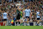 7 June 2009; Dublin's Ger Brennan is shown a yellow card by referee Martin Duffy. Leinster GAA Football Senior Championship Quarter-Final, Dublin v Meath, Croke Park, Dublin. Picture credit: Ray McManus / SPORTSFILE
