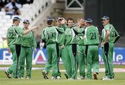 11 June 2009; Kyle McCallan, centre, Ireland, is congratulated after taking a wicket against New Zealand. Twenty20 World Cup - Super Eights Series, Ireland v New Zealand. Trent Bridge, Nottingham, England. Picture credit: Tim Hales / SPORTSFILE