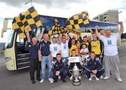 11 June 2009; Ballymun United supporters and players were at a 'Ford Focus on the Footy' photocall ahead of their FAI Ford Cup match against Derry City in the Brandywell on Friday, June 12th. Ford, as part of their 'Focus on the Footy' initiative, will be providing a supporters bus for 50 Ballymun United fans for their 300mile round trip to the Brandywell. At the photocall are Ballymun United players, front from left, Karl Donnelly, David McDonnell, and Robert Keeley, with Ballymun United. supporters. Ballymun Shopping Centre, Ballymun, Dublin. Picture credit: Brian Lawless / SPORTSFILE