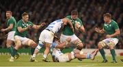 18 October 2015; Iain Henderson, Ireland, is tackled by Agustin Creevy, left, and Pablo Matera, Argentina. 2015 Rugby World Cup Quarter-Final, Ireland v Argentina. Millennium Stadium, Cardiff, Wales. Picture credit: Stephen McCarthy / SPORTSFILE