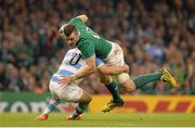 18 October 2015; Robbie Henshaw, Ireland, is tackled by Nicolas Sanchez, Argentina. 2015 Rugby World Cup Quarter-Final, Ireland v Argentina. Millennium Stadium, Cardiff, Wales. Picture credit: Brendan Moran / SPORTSFILE