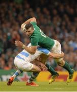 18 October 2015; Robbie Henshaw, Ireland, is tackled by Nicolas Sanchez, Argentina. 2015 Rugby World Cup Quarter-Final, Ireland v Argentina. Millennium Stadium, Cardiff, Wales. Picture credit: Brendan Moran / SPORTSFILE