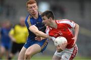 18 October 2015; Hubert Darcy, Pádraig Pearses, in action against Graham Pettit, Clann na nGael. Roscommon County Senior Football Championship Final, Pádraig Pearses v Clann na nGael. Dr. Hyde Park, Roscommon. Picture credit: David Maher / SPORTSFILE
