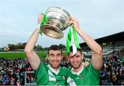 18 October 2015; Sarsfields Seán Campbell, left, and Matty Byrne, lift the the Dermot Bourke Cup after the game. Kildare County Senior Football Championship Final, Athy v Sarsfields. St Conleth's Park, Newbridge, Co. Kildare. Picture credit: Piaras Ó Mídheach / SPORTSFILE