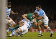 18 October 2015; Iain Henderson, Ireland, is tackled by Leonardo Senatore, left, and Agustin Creevy, Argentina. 2015 Rugby World Cup Quarter-Final, Ireland v Argentina. Millennium Stadium, Cardiff, Wales. Picture credit: Brendan Moran / SPORTSFILE