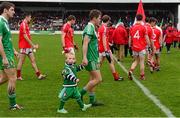 18 October 2015; Harry Tiernan, aged 2, in the pre-match parade with his father, Sarsfields defender Conor Tiernan. Kildare County Senior Football Championship Final, Athy v Sarsfields. St Conleth's Park, Newbridge, Co. Kildare. Picture credit: Piaras Ó Mídheach / SPORTSFILE