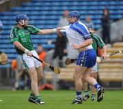 14 June 2009; Stephen Lucey, Limerick, attempts to move Gary Hurney, Waterford, away from a Limerick free during injury time. GAA Hurling Munster Senior Championship Semi-Final, Limerick v Waterford, Semple Stadium, Thurles, Co. Tipperary. Picture credit: Brendan Moran / SPORTSFILE