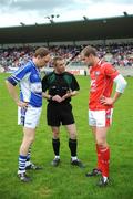 14 June 2009; Referee Michael Duffy, Sligo, speaks to the two captains, Brian McCormack, left, Laois, and Paddy Keenan, Louth, before the game. GAA Football Leinster Senior Championship Quarter-Final, Laois v Louth, Parnell Park, Dublin. Picture credit: Ray McManus / SPORTSFILE *** Local Caption ***