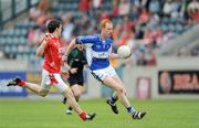 14 June 2009; Padraig Clancy, Laois, in action against Adrian Reid, Louth. GAA Football Leinster Senior Championship Quarter-Final, Laois v Louth, Parnell Park, Dublin. Picture credit: Ray McManus / SPORTSFILE