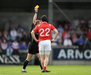 14 June 2009; Adrian Reid, Louth, is shown a yellow card by referee Michael Duffy. GAA Football Leinster Senior Championship Quarter-Final, Laois v Louth, Parnell Park, Dublin. Picture credit: Ray McManus / SPORTSFILE
