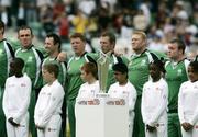 15 June 2009; Ireland players stand in front of the ICC Twenty20 World Cup as they sing their national anthem before their game against Pakistan. Twenty20 World Cup, Super Eights Series, Ireland v Pakistan, The Oval, London, England. Picture credit: Tim Hales / SPORTSFILE