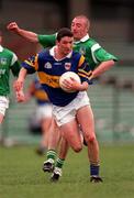 10 May 1998; Brendan Cummins of Tipperary in action against Martin Dineen of Limerick during the Munster GAA Football Senior Championship First Round match between Limerick and Tipperary at Gaelic Grounds in Limerick. Photo by Ray McManus/Sportsfile