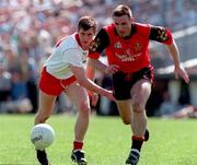 17 May 1998; Fay Devlin of Tyrone in action against Brian Burns of Down during the Ulster GAA Football Senior Championship Preliminary Round match between Tyrone and Down at St Tiernach's Park in Clones, Monaghan. Photo by David Maher/Sportsfile