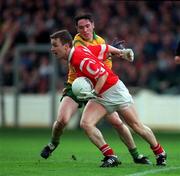 5 April 1998; Brian Collins of Cork in action against Brendan Devenney of Donegal during the National Football League Quarter-Final match between Cork and Donegal at Croke Park in Dublin. Photo by Ray McManus/Sportsfile