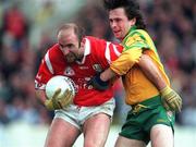 5 April 1998; Brian Corcoran of Cork in action against John Duffy of Donegal during the National Football League Quarter-Final match between Cork and Donegal at Croke Park in Dublin. Photo by Ray McManus/Sportsfile