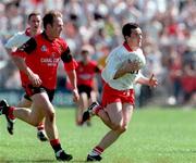 17 May 1998; Brian Dooher of Tyrone in action against Paul Higgins of Down during the Ulster GAA Football Senior Championship Preliminary Round match between Tyrone and Down at St Tiernach's Park in Clones, Monaghan. Photo by David Maher/Sportsfile
