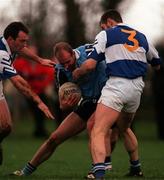 11 January 1998; Brian Stynes of Dublin in action against Denis Lahor, right, with, Eamonn Delaney of Laois during the O'Byrne Cup match between Dublin and Laois at St Margaret's GAA Ground in Dublin. Photo by David Maher/Sportsfile