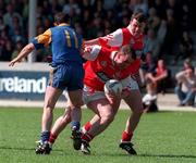 31 May 1998 Louth's Cathal O'Hanlon is tackled by Wicklow's No11 Mick Murtagh also pictured is Louth's   Alan Doherty. Bank of Ireland Football Championship Louth v Wicklow Picture Credit Matt Browne SPORTSFILE