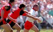 17 May 1998; Ciaran Loughran of Tyrone in action against Finbar Caulfield of Down during the Ulster GAA Football Senior Championship Preliminary Round match between Tyrone and Down at St Tiernach's Park in Clones, Monaghan. Photo by David Maher/Sportsfile