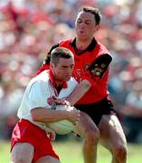 17 May 1998; Ciaran Loughran of Tyrone in action against Simon Poland of Down during the Ulster GAA Football Senior Championship Preliminary Round match between Tyrone and Down at St Tiernach's Park in Clones, Monaghan. Photo by David Maher/Sportsfile