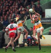 26 April 1998; Ciaran McManus of Offaly in action against Paul McFlynn of Derry during the Church & General National Football League Final match between Offaly and Derry at Croke Park in Dublin. Photo by Ray McManus/Sportsfile