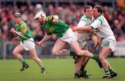 1 March 1998; Colm McGuckian of Dunloy Cuchullains in action against Michael Ward, and Gerry McGrath, right, of Sarsfields during the AIB GAA Hurling All-Ireland Club Semi-Final match between Sarsfields and Dunloy Cuchullains at Mullingar in Co Westmeath. Photo by Ray McManus/Sportsfile