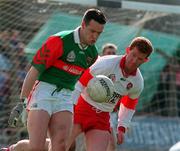 5 April 1998; David Brady of Mayo in action against Gary McGill of Derry during the Church & General National Football League quarter-final match between Derry and Mayo at Pairc Markievicz in Sligo. Photo by Damien Eagers/Sportsfile
