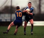 Dublin's Eamon Heery is tackled by  Michael Mulleady Longford during the O'Byrne cup game at Pearse Park Longford. Sunday 4/1/98 Photograph Ray McManus SPORTSFILE
