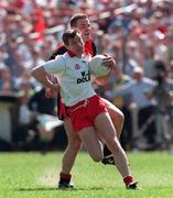 17 May 1998; Eoin Gormley of Tyrone in action against Brian Burns of Down during the Ulster GAA Football Senior Championship Preliminary Round match between Tyrone and Down at St Tiernach's Park in Clones, Monaghan. Photo by David Maher/Sportsfile