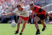 17 May 1998; Eoin Gormley of Tyrone in action against Brian Burns of Down during the Ulster GAA Football Senior Championship Preliminary Round match between Tyrone and Down at St Tiernach's Park in Clones, Monaghan. Photo by David Maher/Sportsfile