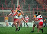 26 April 1998; Fergal McCusker and Dermot Dougan of Derry in action against Ronan Mooney of Offaly during the Church & General National Football League Final match between Offaly and Derry at Croke park in Dublin. Photo by Ray McManus/Sportsfile