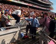 9 August 1998; Clare manager Ger Loughnane is helped back onto the pitch by Clare County Board chairman Robert Frost after the GAA Hurling All-Ireland Senior Championship Semi-Final match between Offaly and Clare at Croke Park in Dublin. Photo by Ray McManus/Sportsfile