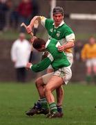 National Hurling League, Division 1A, Offaly v Limerick, Birr. 8/3/98. Offaly's Hubert Rigney is challenged by Limerick's Clement Smith. Photograph © Matt Browne SPORTSFILE.