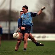 Dublin's Ian Robertson clears his lines under pressure from Longford's Ciaran Fox during the O'Byrne cup game at   Pearse Park Longford. Sunday 4/1/98 Photograph Ray McManus SPORTSFILE