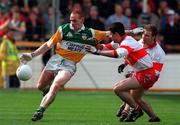 26 April 1998; James Stewart of Offaly in action against Fergal McCusker and Kieran McKeever of Derry during the Church & General National Football League Final match between Offaly and Derry at Croke Park in Dublin. Photo by Matt Browne/Sportsfile